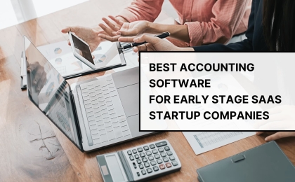 Business team using laptops and calculator while discussing best accounting software for early stage SaaS startup companies