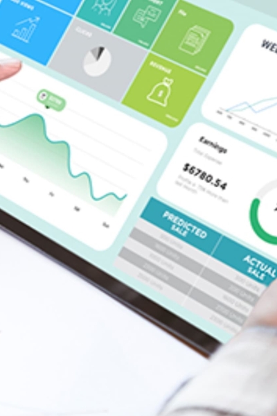 Marketing professional analyzing sales and social media data on digital automation dashboard